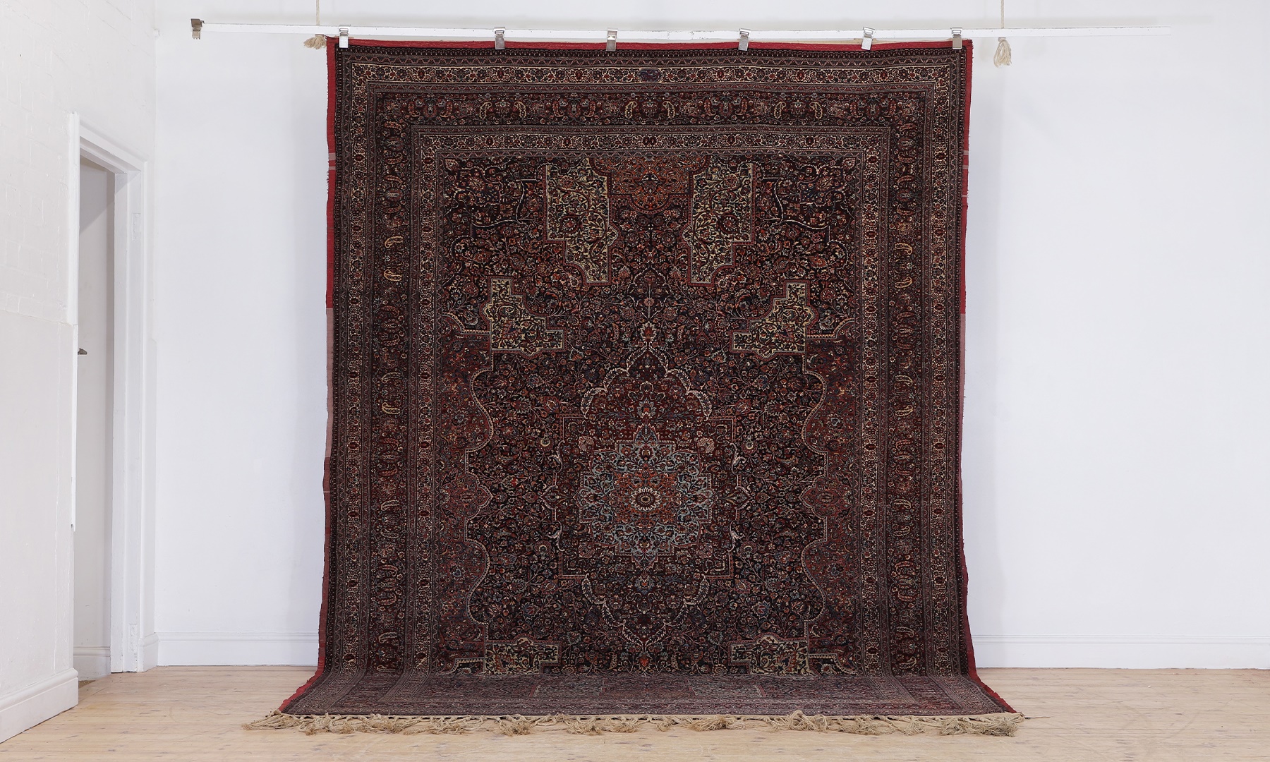 A Persian Mashad Amoghli wool carpet, first half of the 20th century (Sold for £27,300)